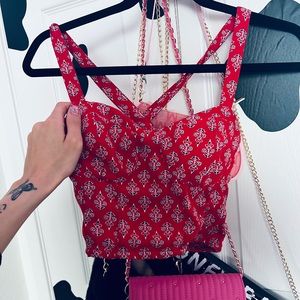 🎃super cute red tanktop with cross straps on back. barely worn:)